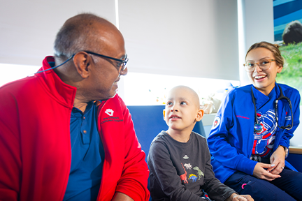 On-site teacher Mr. George, Joe D nurse, and patient at Magnet celebration