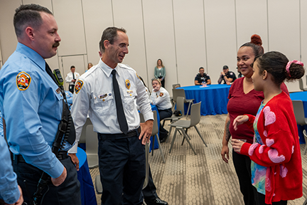 Jestina talking to members of rescue team